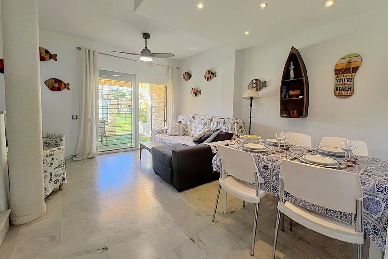 Foto 797c8077-fc17-401f-9807-0e528be28d39. Casa adosada adosado en urbanización privada con terraza y piscina, a 200 metros de playa central en Isla Cristina