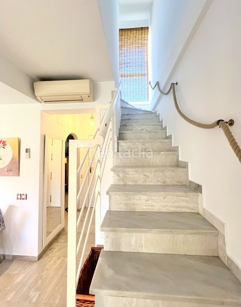 Foto 8b608bf4-858d-47d7-b0b6-01b3ca974be4. Casa adosada adosado en urbanización privada con terraza y piscina, a 200 metros de playa central en Isla Cristina