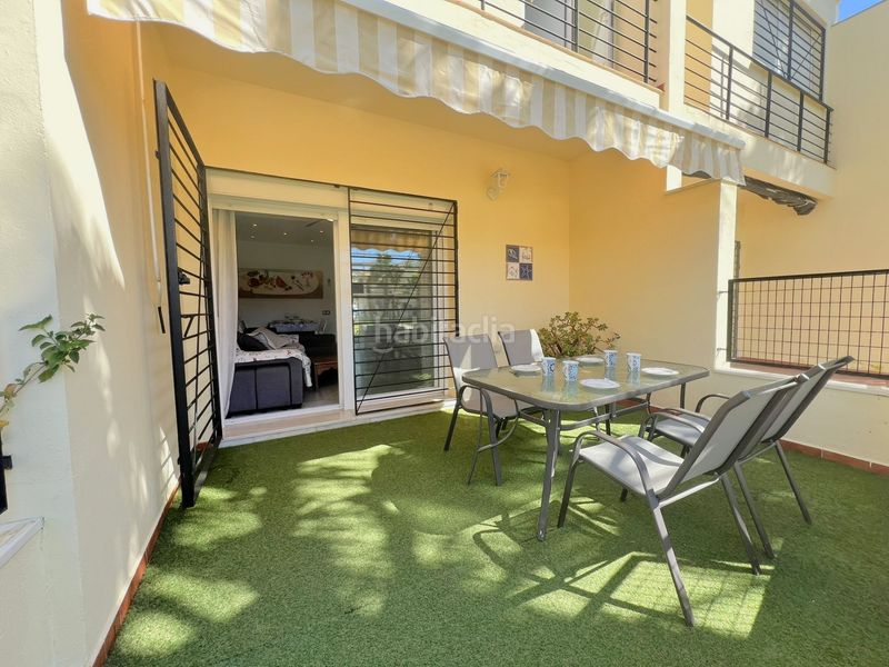 Foto 9e0abbc3-3dc1-4a3e-9a81-1ec40fd182dd. Casa adosada adosado en urbanización privada con terraza y piscina, a 200 metros de playa central en Isla Cristina