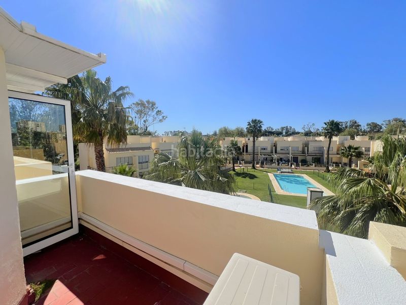 Foto a88df7e7-7e73-471b-9623-7a21f284b072. Casa adosada adosado en urbanización privada con terraza y piscina, a 200 metros de playa central en Isla Cristina