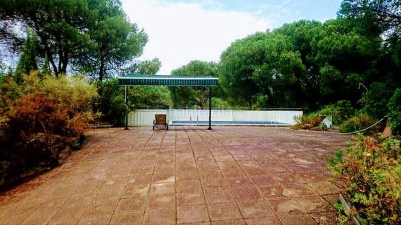 Foto 7891269d-1508-418c-9ca6-7e50d0ac68b9. Casa aparellada amb xemeneia calefacció aparcament piscina a Córdoba