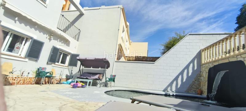 Foto 1f93f22f-ee17-4623-9e08-ee6ee64c7ea6. Casa adosada espectacular casa adosada 4 hab. 235m2, garaje privado, piscina con cascada, terraza de 156m2 y mucho más! en Málaga