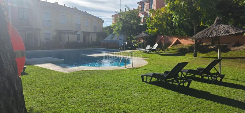 Foto 35dc5fc0-2139-41c1-8830-119862e2aaec. Casa adossada amb aparcament piscina a Islantilla golf Islantilla