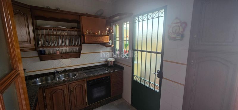Foto db75ac32-c095-4961-bbbf-3d9c46de492d. Casa adossada amb aparcament piscina a Islantilla golf Islantilla