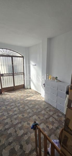 Foto 0452ce6d-b89f-45ec-b35d-f84b1f87e239. Casa adossada amb aparcament a Puebla del Río (La)