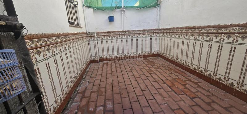 Foto 1c613895-bac9-48fb-83f1-9e96da0e31a5. Casa adossada amb aparcament a Puebla del Río (La)