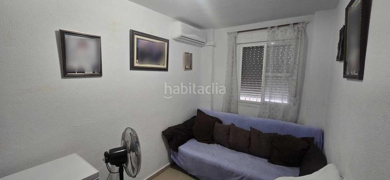 Foto 5255efe4-33f9-46b8-b192-293745e22d3c. Casa adossada amb aparcament a Puebla del Río (La)