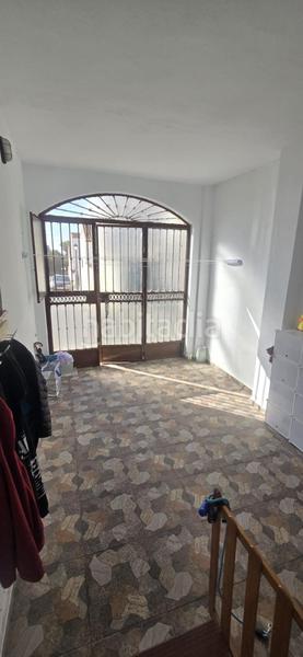 Foto c8431e87-2fcf-4892-b3ab-e7f619f938ea. Casa adossada amb aparcament a Puebla del Río (La)