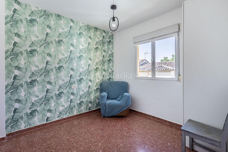 Foto f861ee6e-12fe-48d4-86a5-1b80ea21c3fb. Casa adossada amb aparcament a Huétor Vega