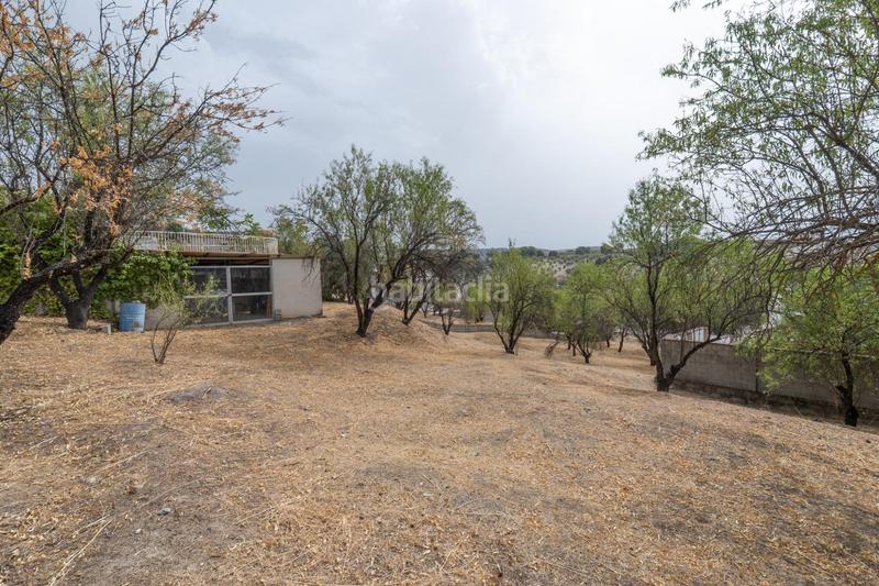 Foto 47e3f4d1-6c2f-4c2e-a4fc-430b2ea694ba. Chalet en camino de la barrera (far) 58 el Fargue 2000 metros de parcela segregable con chalet de 178m en tres plantas mas nave de 90 metros en Granada