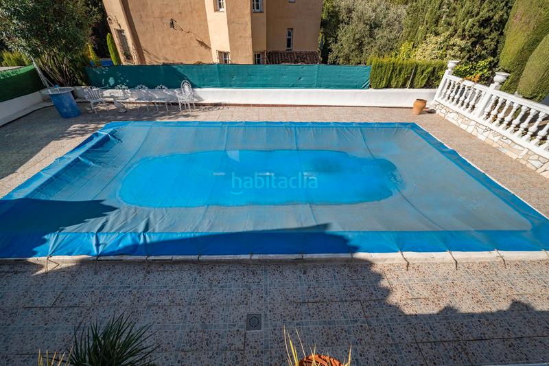 Foto 1ad086db-8e07-4246-b61e-15047ea9d35e. Chalet in calle aynadamar 5 in Alfacar