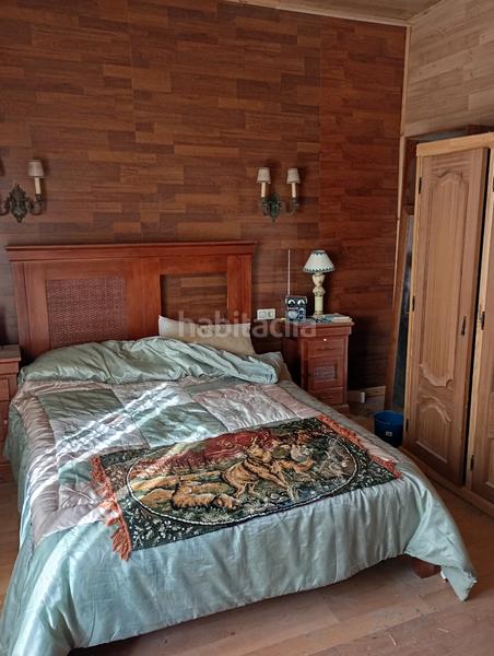 Foto 070d5497-d6bc-49c0-be88-600ec4fc0bfa. Casa con camino riscaldamento parcheggio in Atarfe