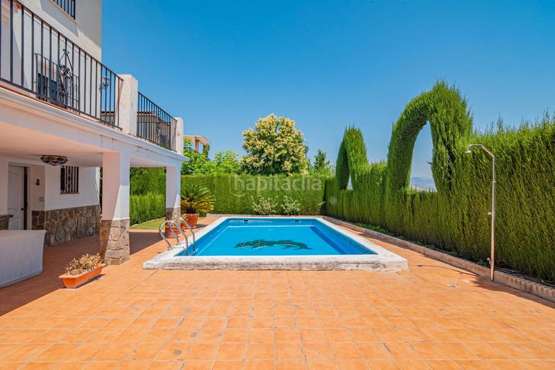 Foto d005efb0-ddf2-46e9-adb2-a08dcd286141. Chalet con camino piscina in Barrio de la Vega Monachil