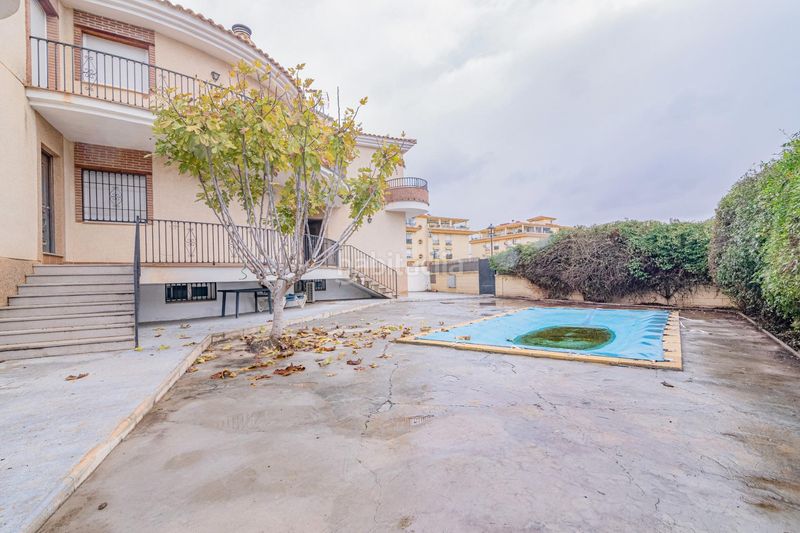 Foto e0f35903-714c-409a-8869-a8845d4e0968. Xalet amb xemeneia calefacció aparcament piscina a Atarfe