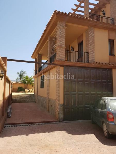 Foto 22cd0811-8c9b-4701-b1ef-741f030d470f. Xalet amb xemeneia aparcament piscina a Cártama