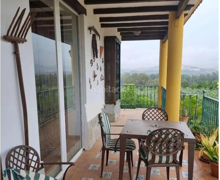 Foto 6bfb7577-62dd-4f22-8be9-d0d4d9f6b6ec. Xalet amb xemeneia aparcament a Coín