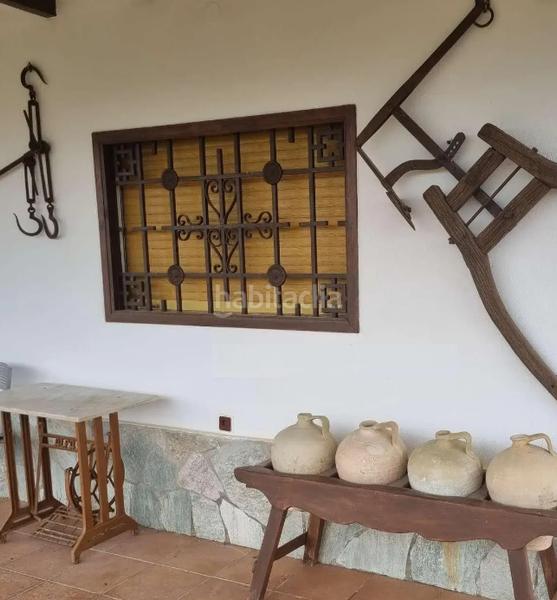 Foto b9074be1-9ffb-43ac-893e-74ed6f019ced. Xalet amb xemeneia aparcament a Coín