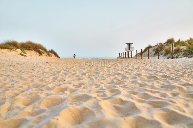 Foto 0f6d8cdc-1a97-4cc5-b449-5c2e5921687c. Semi detached house with parking pool in Islantilla golf Islantilla