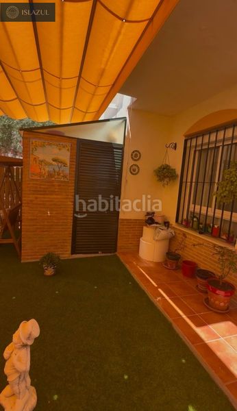 Foto 4ed42ddc-c65f-43a3-930f-820895d549b4. Casa aparellada amb calefacció aparcament piscina a Islantilla