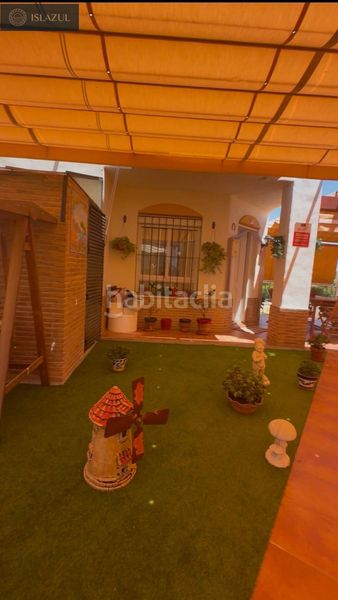 Foto 86ec771f-ab85-4e25-bc01-2ce87599e11b. Casa aparellada amb calefacció aparcament piscina a Islantilla