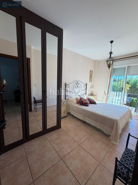 Foto cc63de14-a44f-41ef-a97c-113e7ac1d4dc. Casa adossada amb aparcament piscina a Islantilla golf Islantilla