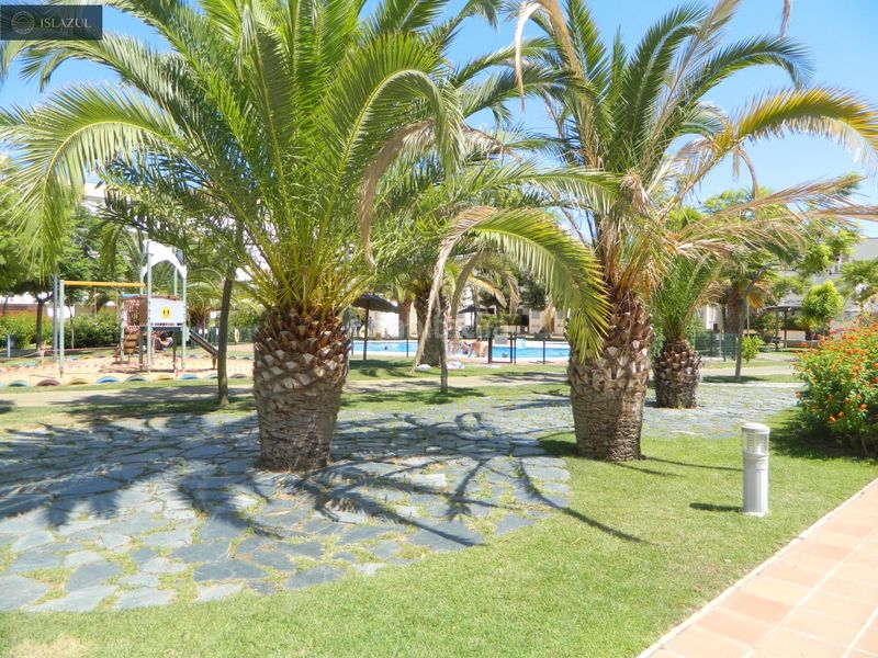 Foto b83af7a4-65ea-4d13-8a26-1f026068f545. Semi detached house with heating pool in Isla Cristina