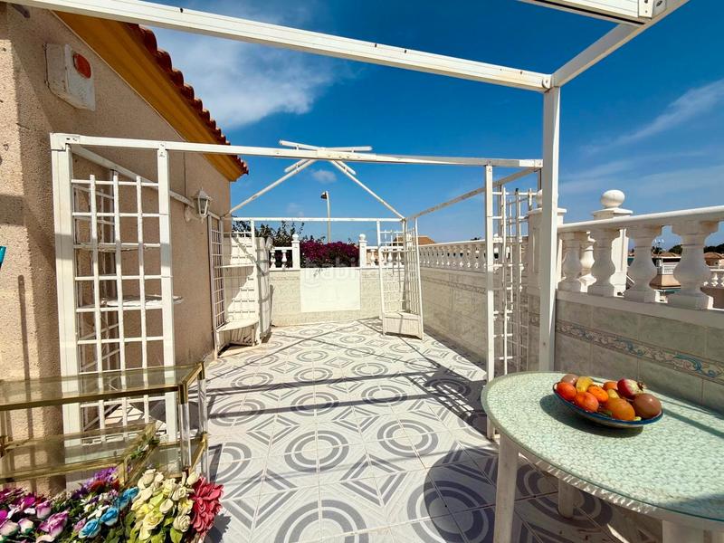 Foto f236f99f-3597-46e8-90b3-7395e0273467. Casa a schiera con camino parcheggio piscina in Los Balcones-Los Altos Torrevieja