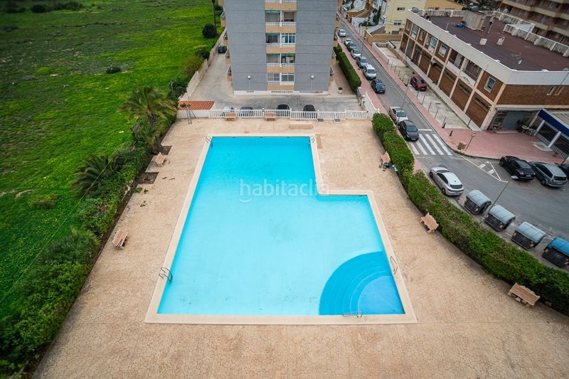 Foto 19726fc4-ca4d-4a1c-8237-eab38cc7837e. Apartament amb piscina a Punta Prima Torrevieja