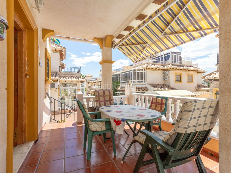 Foto 1a4000d9-cab1-46d4-8989-229a38d26fc2. Casa aparellada amb piscina a Playa Flamenca Orihuela