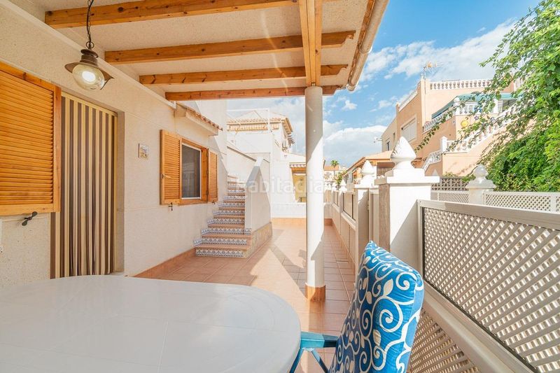 Foto 2c08f0f5-00b8-480d-a8d1-84b3aa5b1369. Casa aparellada amb piscina a Playa Flamenca Orihuela