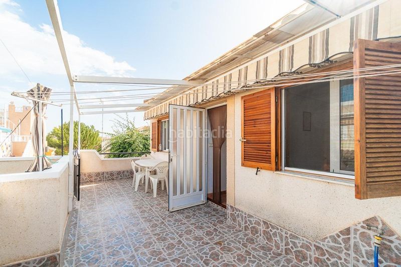 Foto fa5e3239-83ae-4eb5-80fd-26c422afc385. Casa aparellada amb piscina a Playa Flamenca Orihuela