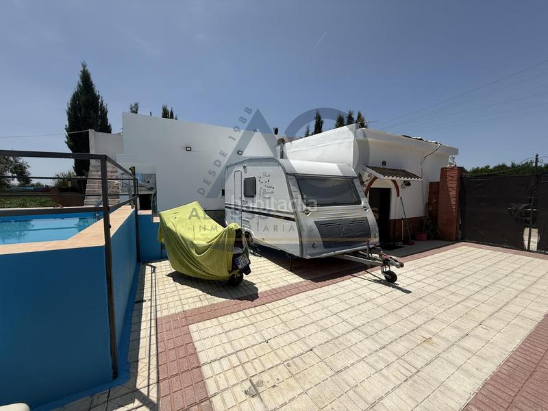 Foto ff6c7c15-a343-496f-a230-59f423e9e00b. Masía parcela rústica en urbanización las mesas en Utrera