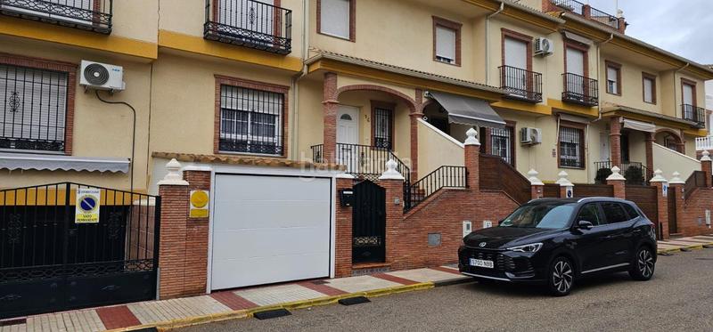 Foto 3cc946c9-5d19-4bfe-8f25-635c60725dc4. Casa amb aparcament a Atarfe