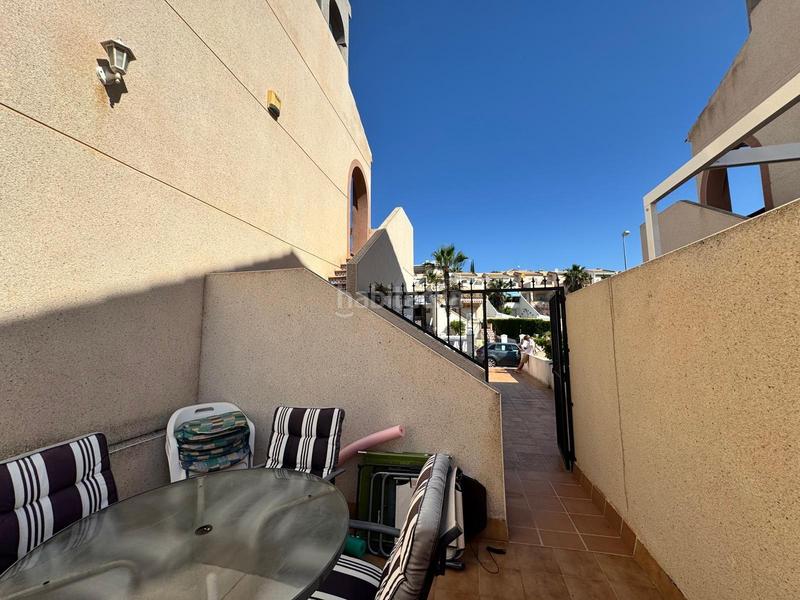 Foto 4f2c83ea-c2db-4e27-b6e5-ee9210df8eb3. Semi detached house with parking pool in Villamartín-Las Filipinas Orihuela