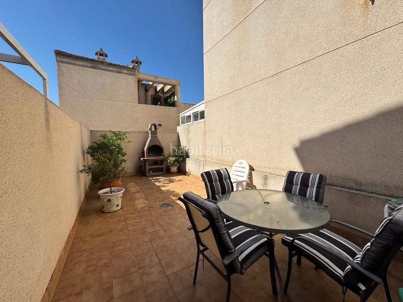 Foto 8469ce56-e442-464e-b33d-9b5feecefed4. Semi detached house with parking pool in Villamartín-Las Filipinas Orihuela
