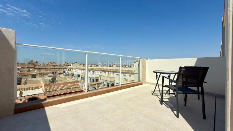 Foto 32f6b571-5d3c-44b3-b8a2-4631b243910d. Alquiler casa dúplex con aparcamiento, piscina comunitaria, terraza con vistas maravillosas y a 5 minutos del mar. en Santa Pola