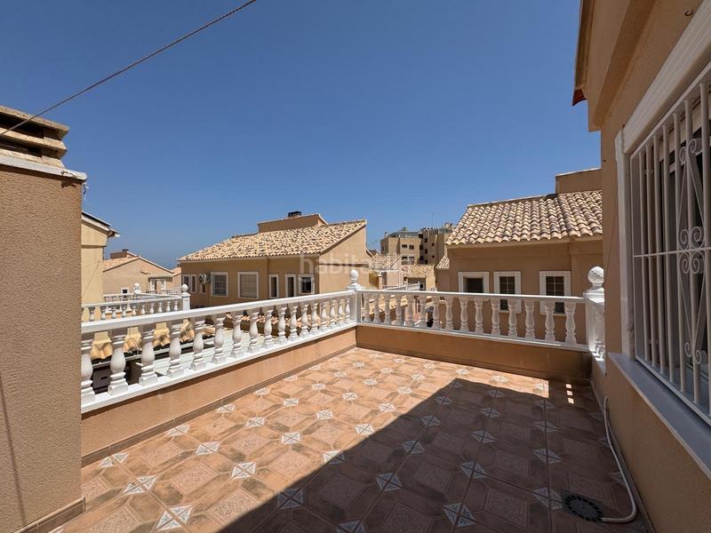 Foto ce8961fd-f079-401f-8af2-7c1b21d2a068. Maison jumelée avec parking piscine dans El Moncayo - El Pòrtic Guardamar del Segura