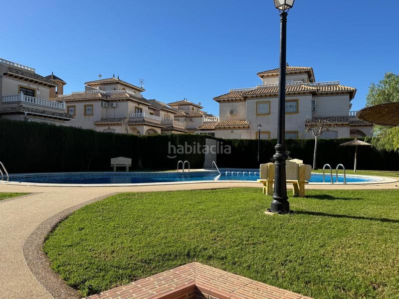 Foto d8ddeecd-e69d-4d86-9bfa-e7e0ad195c64. Casa a schiera con parcheggio piscina in Lomas de Cabo Roig - Los Dolses Orihuela