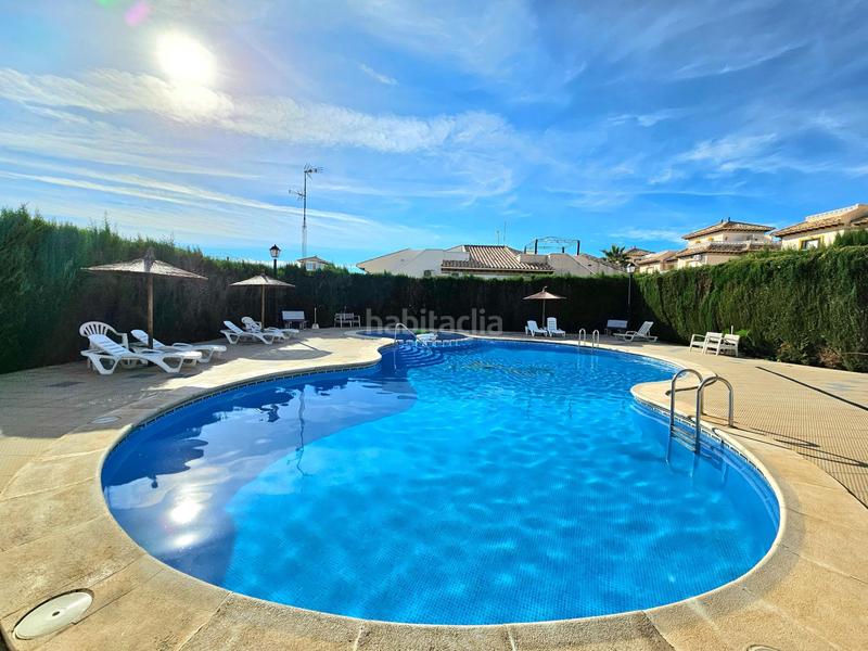 Foto 8b718309-f12b-41e0-b46a-a54b9fe72eb0. Casa adossada amb aparcament piscina a Lomas de Cabo Roig - Los Dolses Orihuela