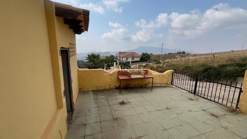 Foto b84a5357-65f7-4124-b5e0-1d1709b23f7f. Casa adossada amb xemeneia aparcament a Aledo