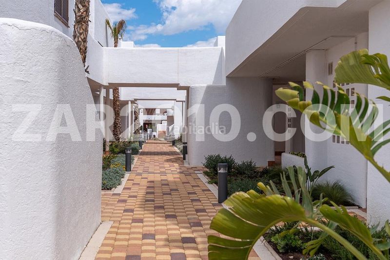 Foto 7348c4b9-f95e-4b63-bf7d-57fe6ba624db. Planta baja residencial mar de pulpí fase 8 pisos de 3 dormitorios en primera línea de playa en San Juan de los Terreros