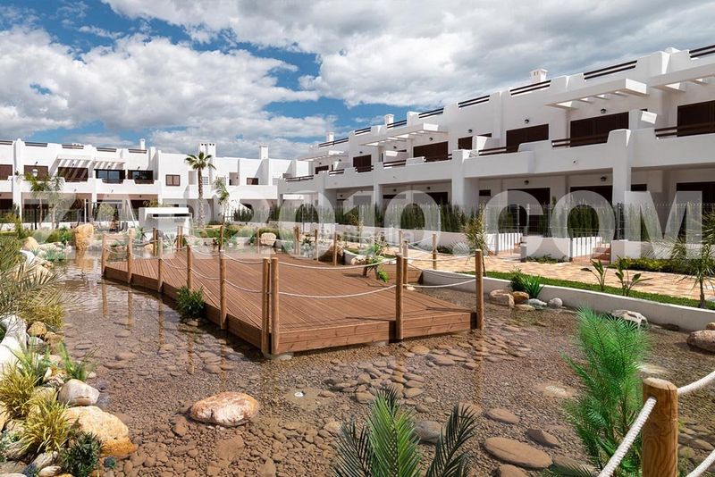 Foto 753811ce-96ba-4c6e-af2e-e91d065374ba. Planta baja residencial mar de pulpí fase 8 pisos de 3 dormitorios en primera línea de playa en San Juan de los Terreros