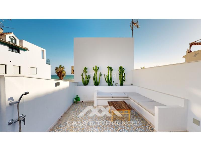 Foto 7d28d8d0-2ea2-4178-98ff-fc85bd0b1dd9. Casa adossada a Caleta de Velez