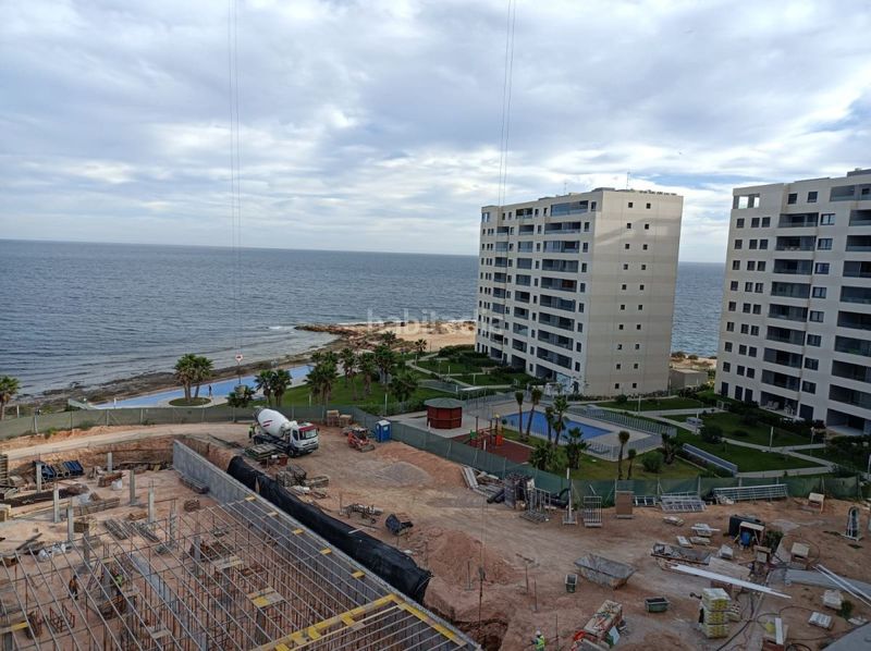 Foto c6e15a83-0866-4a30-bcea-805e95acd4bb. Apartament amb calefacció aparcament piscina a Punta Prima Torrevieja