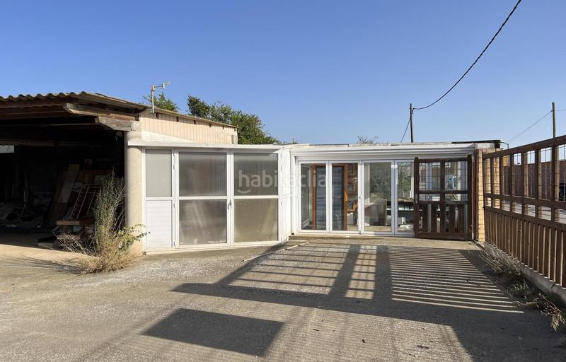 Foto 459bd94b-0794-47d9-8277-fbce3ce41a54. Casa  para reformar con local y 3 parcelas en Vilamacolum