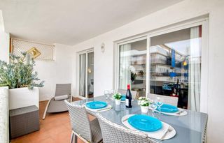 Apartamento  Port joan. Acogedor apartamento con piscina comunitaria y terraza en entorn