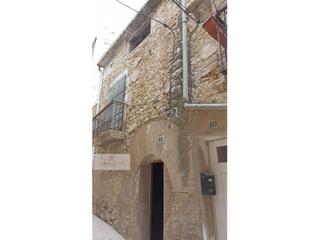 Casa a Batea. Casa de piedra en batea