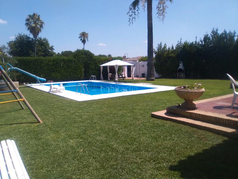 Foto d09fb502-ffea-46f5-9659-8d455d0d9fd4. Chalet mit kamin parking pool in La Paz Alcalá de Guadaira