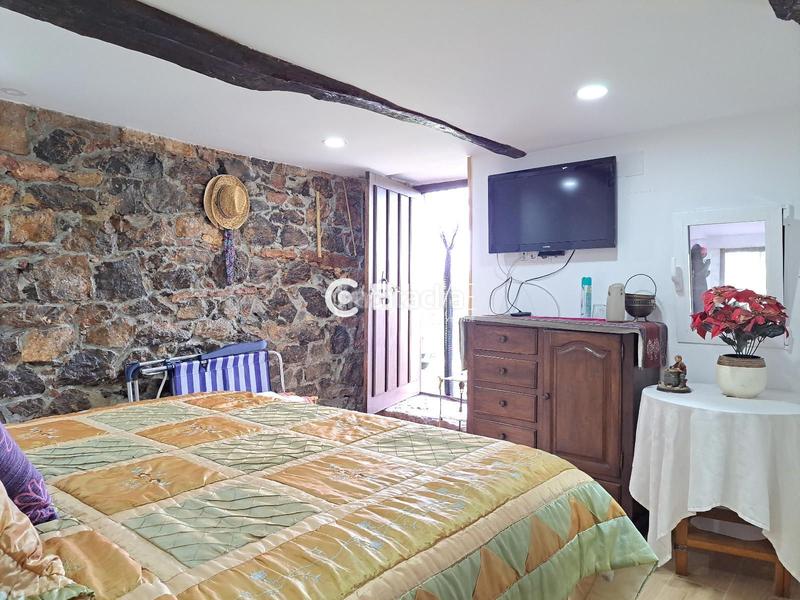 Foto dcef4bb8-87dc-4974-8d50-eb6462700d8e. Casa adosada casa con jardín en venta en Grado