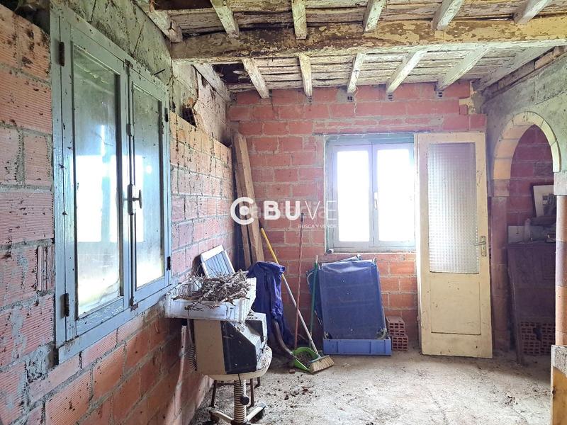 Foto f1665f1c-63fd-4ac3-b180-b418367a91a5. Casa adosada casa con jardín en venta en Grado